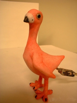 Naked pigeon stop-motion puppet ready for set