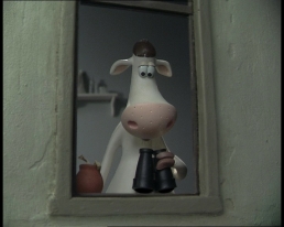 Stop-motion cow looking out the window