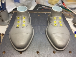 Finished sculpture of the shoes ready for the molds