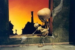 Tungsinn: the main stop-motion puppet character sitting in the window