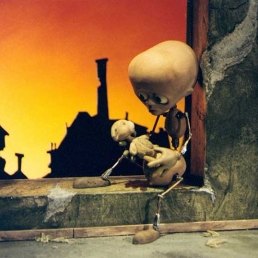 Tungsinn: the main stop-motion puppet character sitting in the window