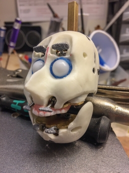 Stop-motion animation head mechanics with silicone teeth